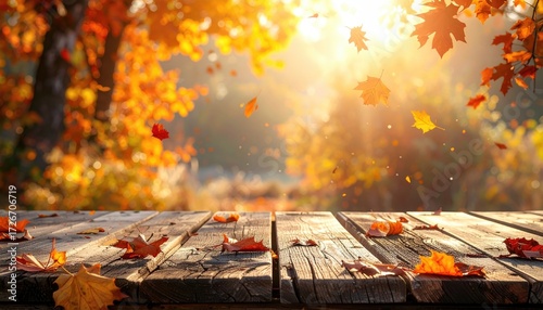 Autumn leaves fall on weathered wooden table