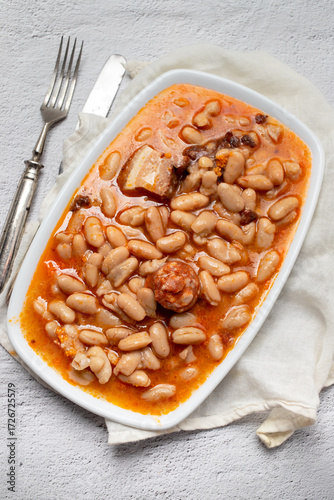 typical portuguese dish chispalhada with beans in dish