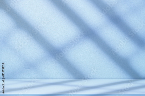 Blue Background Studio with Gradient White Light on Podium stage for Product Display Present,Empty Backdrop wall texture with abstract sun light on floor concrete in pastel blue tone color for Winter