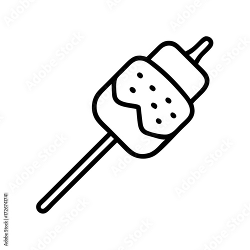 Marshmallow on stick for roasting over campfire in outdoor setting  