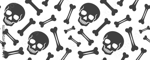 Halloween-themed seamless pattern with skulls and bones on white background  