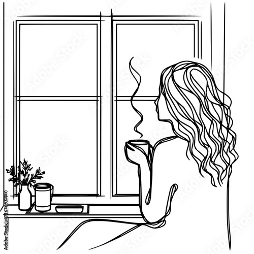 Woman enjoying a hot drink by the window
