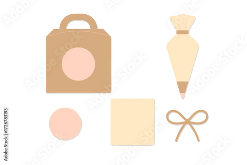 Assorted baking and gifting elements featuring a brown gift box, piping bag, blank labels, and decorative bow