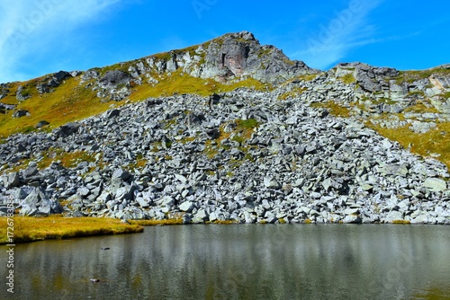 Mountain landscape with a scree above Oberer Kaltenbach lake at Sölktäler naturpark in Niedere Tauern, Styria, Austria