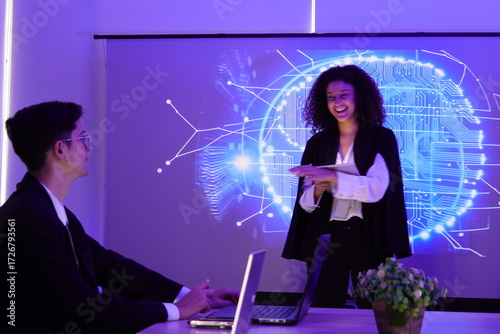 Two IT development staff, a man and a woman discuss consulting work in a meeting, explaining to use a data management system, business intelligence, data statistics, marketing analysis conference room