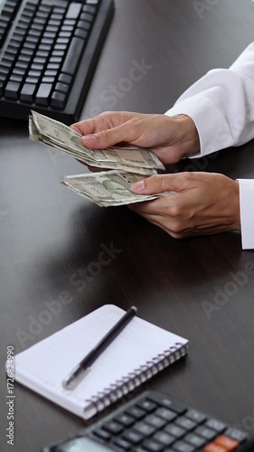 Close up view of woman hands and Indian rupee banknotes and coins. Concept of bank office work, saving money for retirement, cash settlement, financial success, literacy and income planning in India.