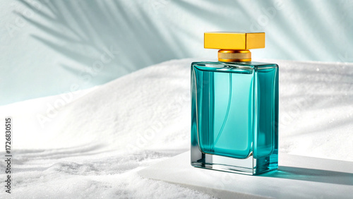 Minimalist teal perfume bottle with yellow cap on soft white background