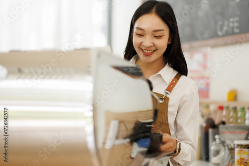 Young asian woman barista wearing apron using professional coffee grinder and managing orders in modern cafe
Free Download Young asian woman barista wearing apron using professional coffee grinder and managing orders in modern cafe
- GFXLoad
