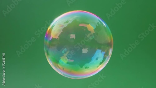 Close-up of a floating soap bubble with rainbow iridescence. It rotates slightly and reflects its surroundings. Full green screen for easy isolation