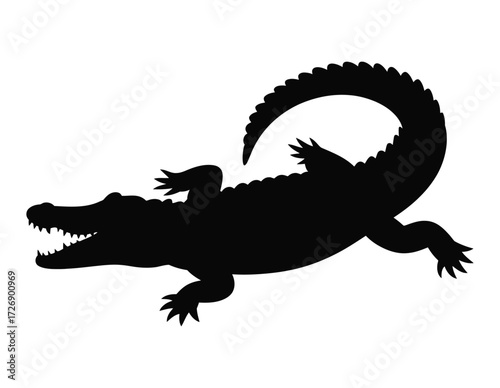 Silhouette of a fearsome alligator with its mouth open showing sharp teeth in a dynamic pose