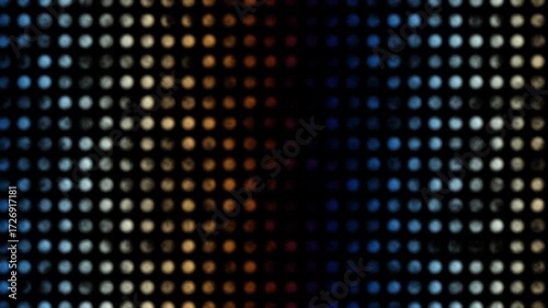A vibrant and energetic abstract animation featuring a dense field of shimmering particles flowing across a dark background.