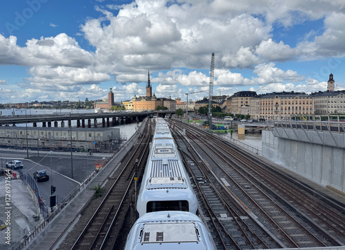 View of Stockholm with a subway train on a bridge.