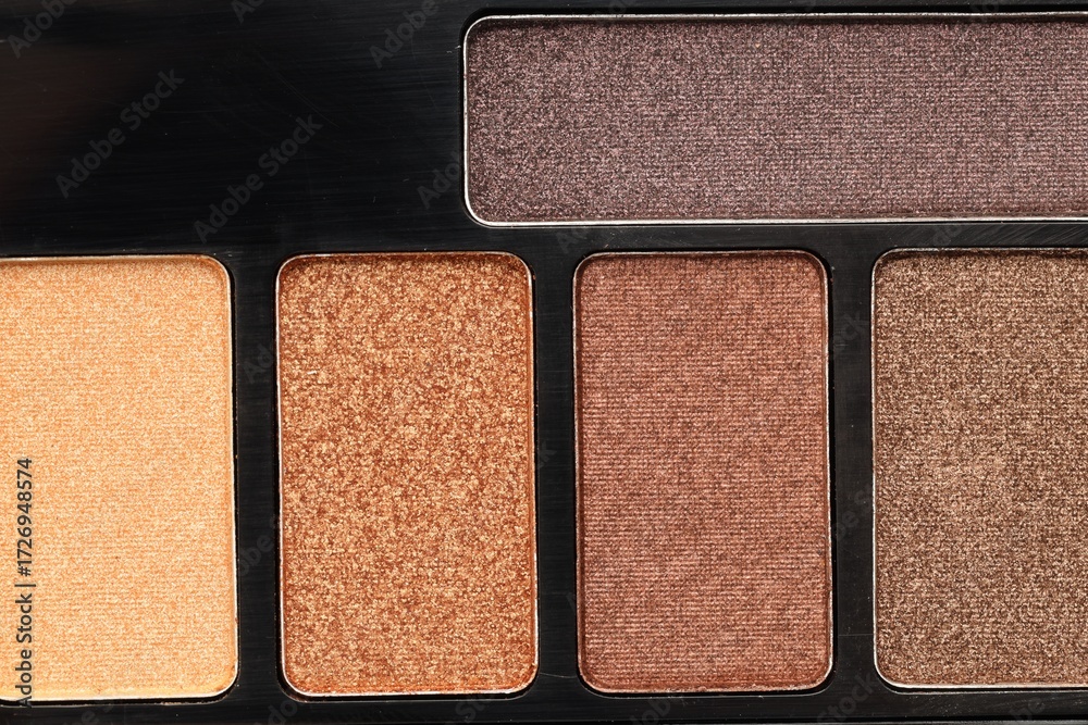 Fototapeta premium Beautiful eyeshadow palette as background, top view