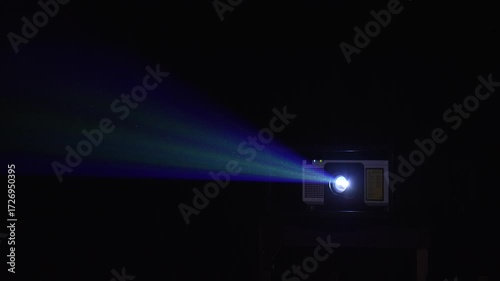  Projector lighting up the dark. A vintage projector illuminates the dark, creating a magical atmosphere perfect for film lovers.  Illuminating swirling dust particles, cinematic noir aesthetic.