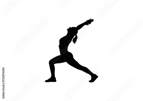 Silhouette of a person in a warrior yoga pose.