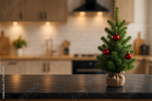Modern black marble countertop with a small Christmas tree on the kitchen background, hyper-realistic 4K photo. 16:9