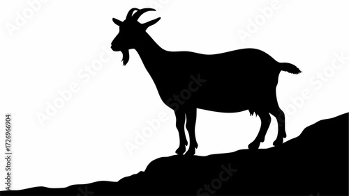 Majestic goat silhouette stands proudly on rocky terrain, symbolizing resilience and freedom.