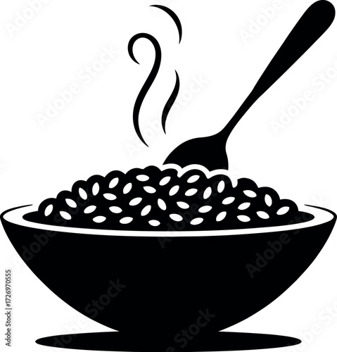 Black silhouette of steaming risotto in bowl with spoon