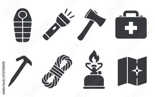 Camping essentials silhouettes: sleeping bag, flashlight, axe, first aid kit, ice axe, rope, stove, map