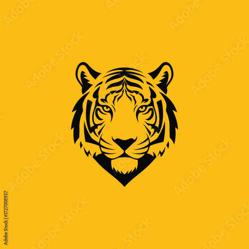 Powerful Tiger Head Silhouette with Fierce Expression on Yellow Background