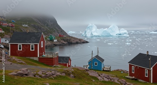 Coastal village with iceberg