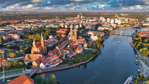 Golden Hour Aerial View of Ostrów Tumski in Wrocław with Gothic Cathedral, Tumski Bridge and Historic Architecture by the Oder River, Poland