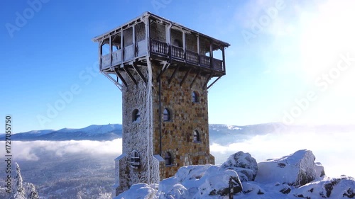 view of Szklarska Poreba in clouds. snow on Wysoki Kamien peak and winter landscape under bright sun. Poland