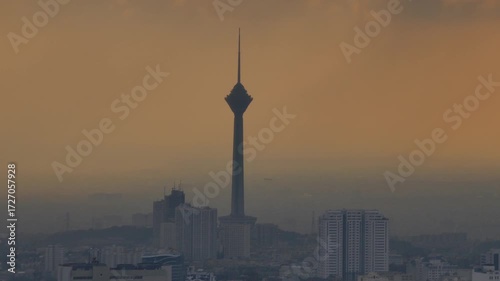 Wallpaper Mural Milad Tower standing tall over Tehran at sunset; city buildings and evening light frame the iconic tower in a cinematic skyline composition  Torontodigital.ca