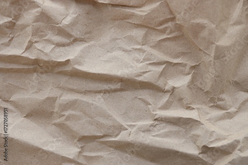 Brown crumpled recycled paper texture background. Kraft Paper