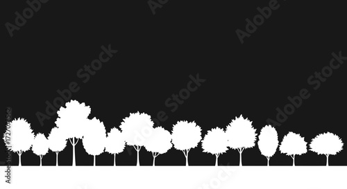 Silhouette of various tree species against a contrasting black backdrop landscape