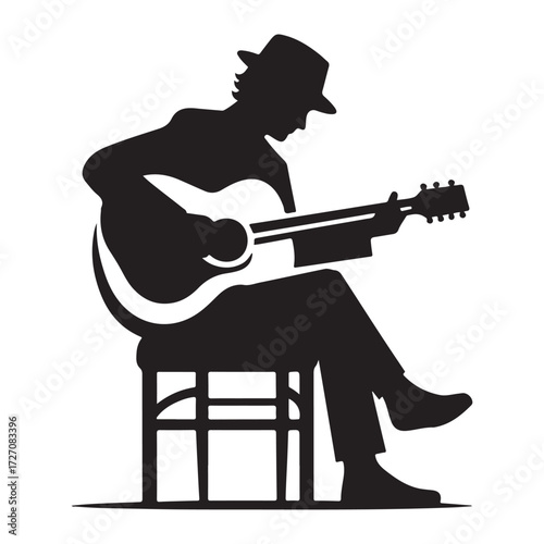 Silhouette of a Guitarist Playing an Electric Guitar