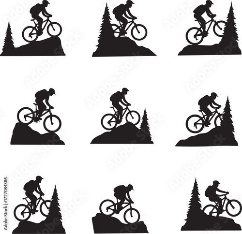 Black silhouette mountain biker on rocky terrain with trees