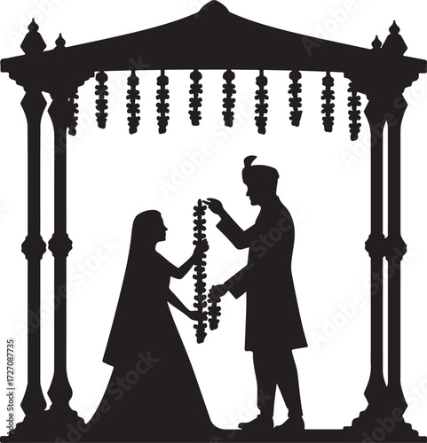 Indian wedding ceremony couple exchanging garlands under canopy