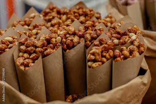 Photos Assorted nuts in baskets at market