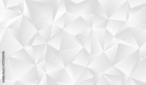 A vibrant composition of overlapping triangles and polygons in varying shades showcasing a captivating interplay of light and shadow.