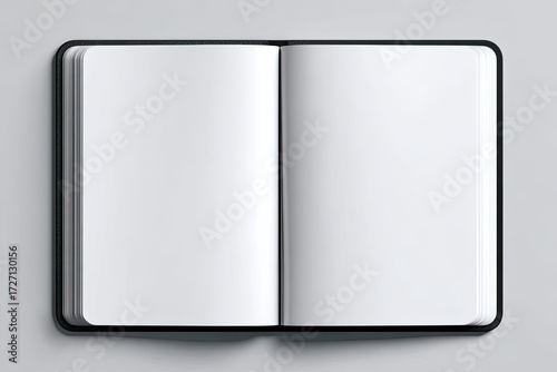 Open black notebook on light gray background