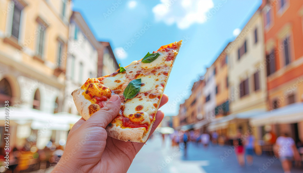 custom made wallpaper toronto digitalHand holding a slice of Italian street pizza with mozzarella and tomato, photographed outdoors with blurred city background