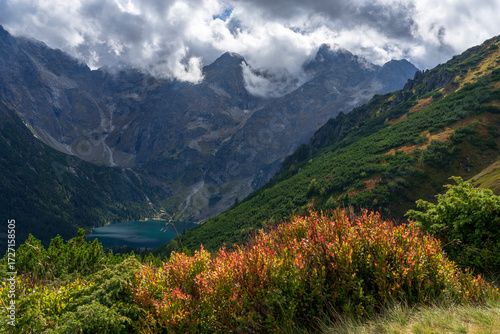 Autumn view of Morskie Oko surrounded by the mountain peaks of the High Tatras.