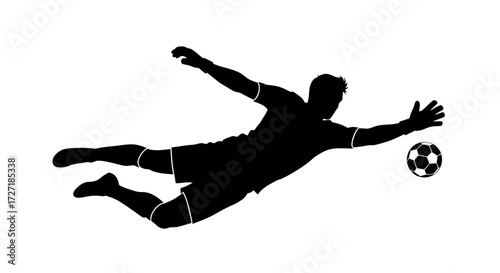 Dynamic silhouette of a soccer goalkeeper in mid air making a diving save to catch the ball
