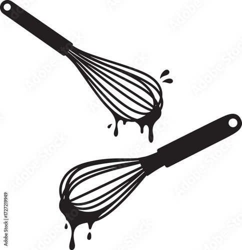 Two black kitchen whisks with dripping batter silhouette