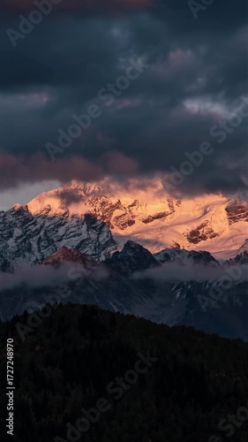 Magic Sunrise with Clouds Reveal Snowy Mount Tetnuldi in Caucasus Mountains