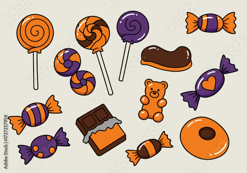 Assortment of Halloweenthemed orange and purple candies and chocolates