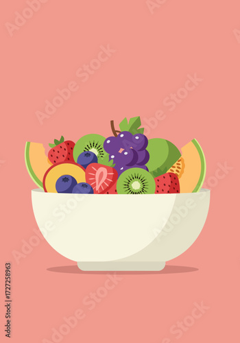 Bowl of colorful mixed fresh fruit on a solid pink background