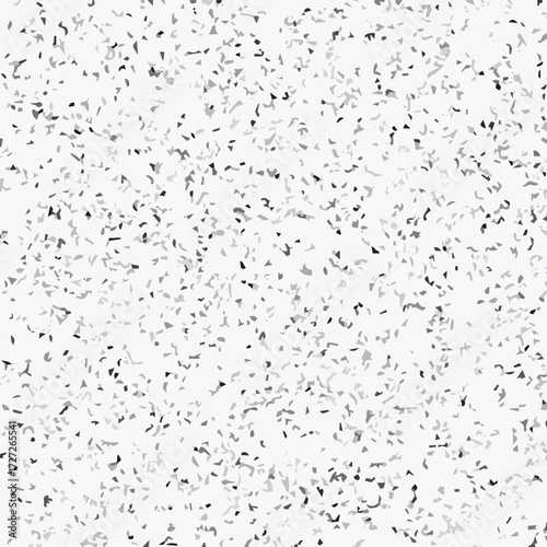 Abstract terrazzo seamless pattern with scattered stone chips in gray and black tones on white background texture.