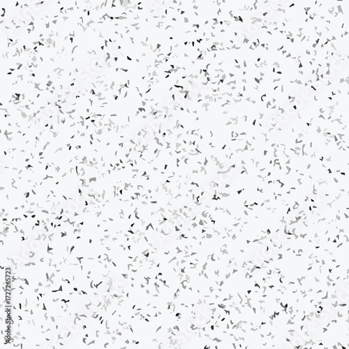 Abstract terrazzo seamless pattern with scattered stone chips in gray and black tones on white background texture.