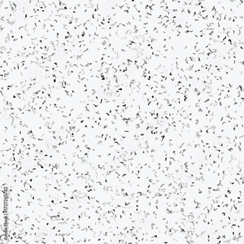 Abstract terrazzo seamless pattern with scattered stone chips in gray and black tones on white background texture.