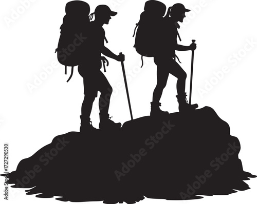 Two hikers with backpacks and trekking poles on a rocky outcrop