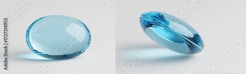 Two views of a translucent, light blue, oval-shaped object, possibly glass or resin, are shown against a plain white background; one is positioned upright, the other is tilted
