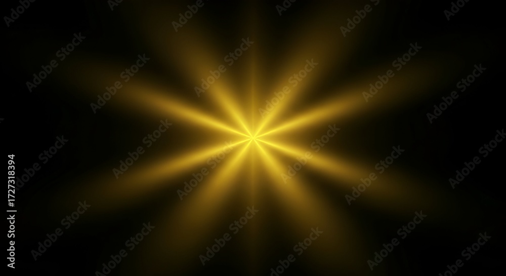 Obraz premium Radiant golden starburst effect emanates brilliant light against a deep black background, perfect for celebratory or dramatic visuals.