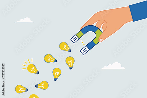businessman with magnet to magnetize light bulb ideas.